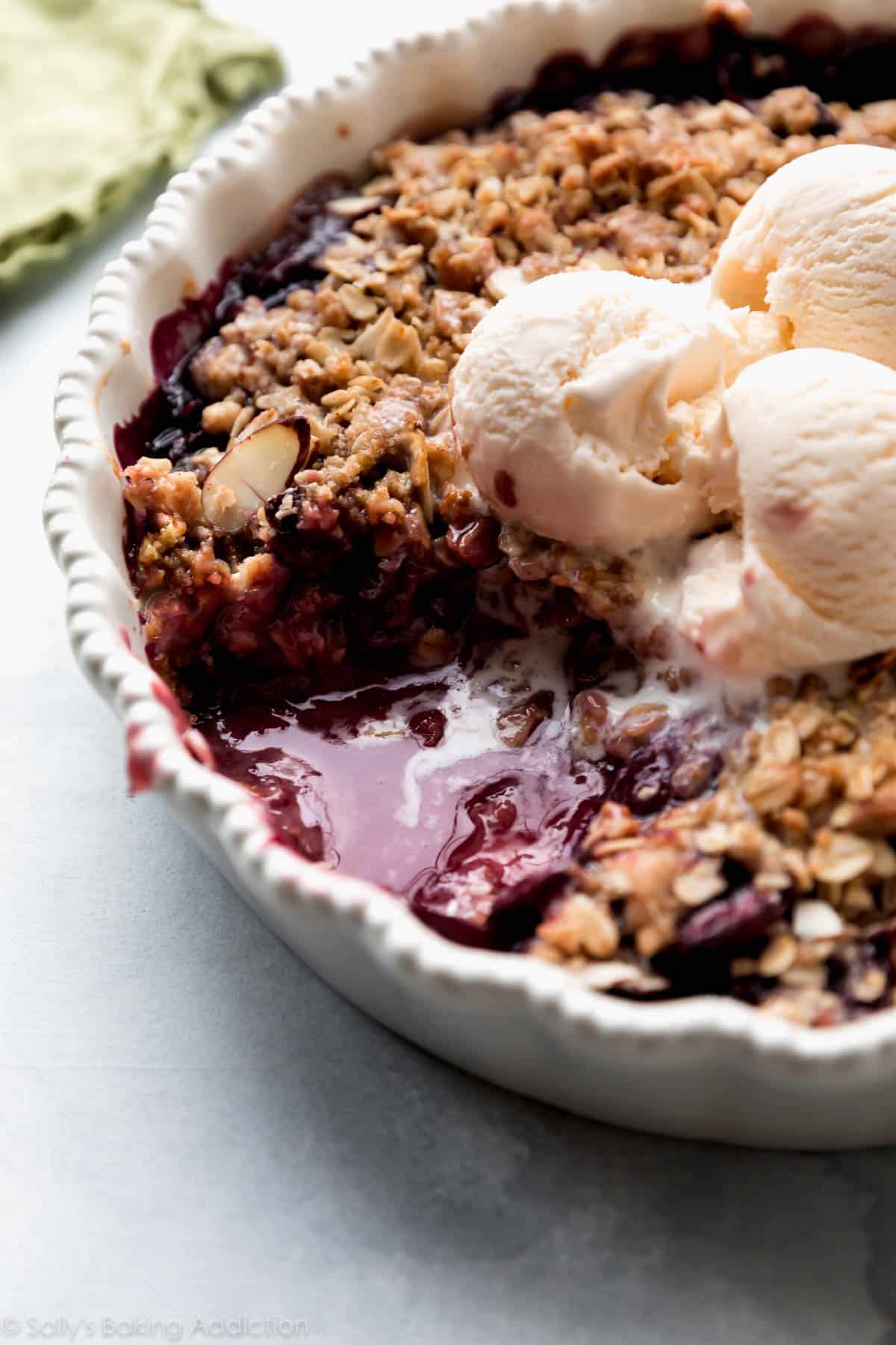 bourbon cherry crisp with ice cream on top