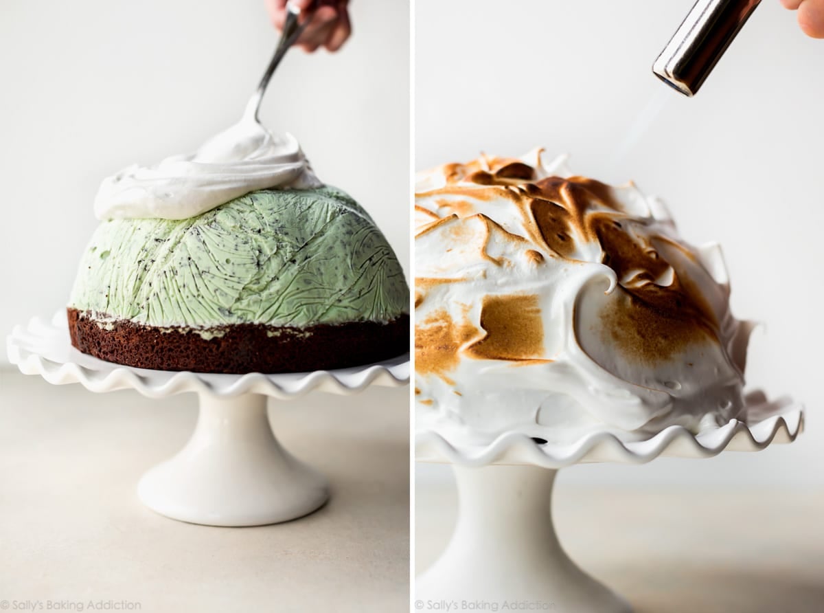 spreading meringue topping onto baked Alaska and using a kitchen torch to toast the meringue topping