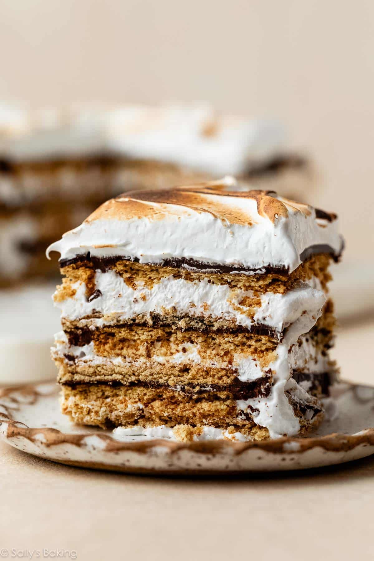 piece of no bake s'mores cake on plate.