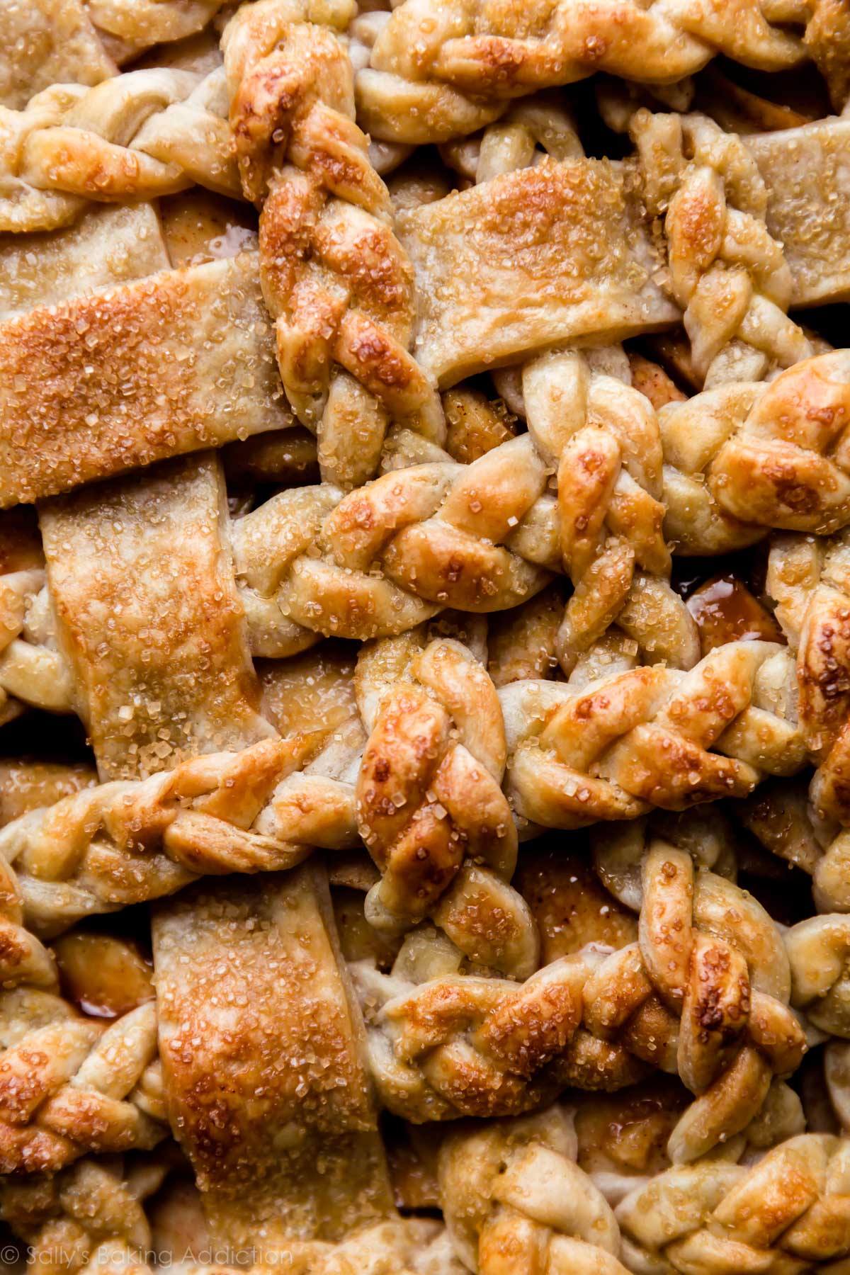 zoomed in image of braided pie crust after baking