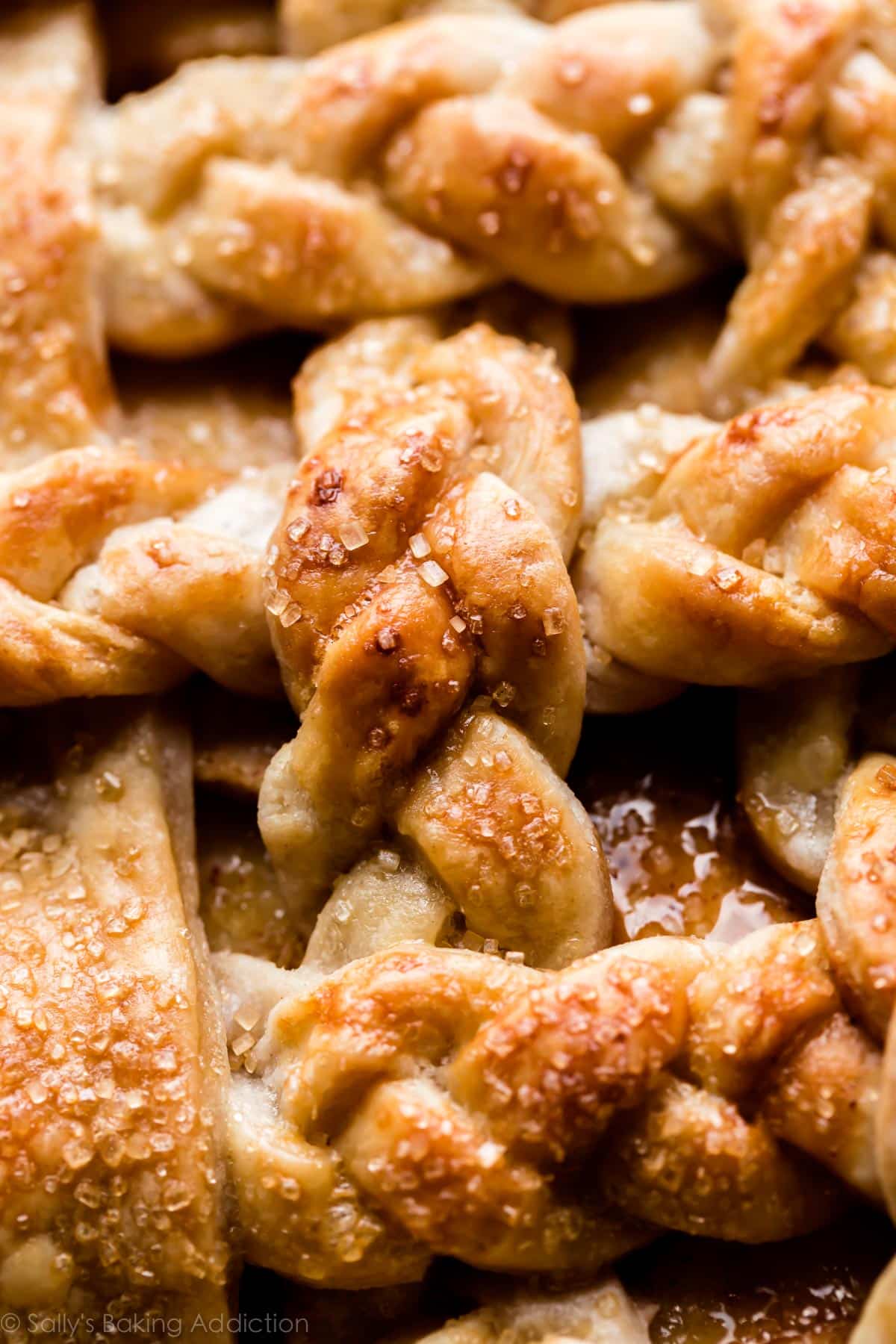 zoomed in image of braided pie crust after baking