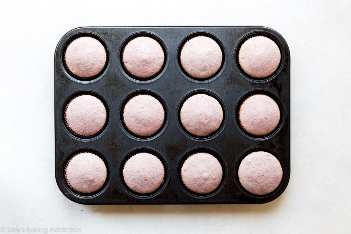 baked strawberry cupcakes in a cupcake pan