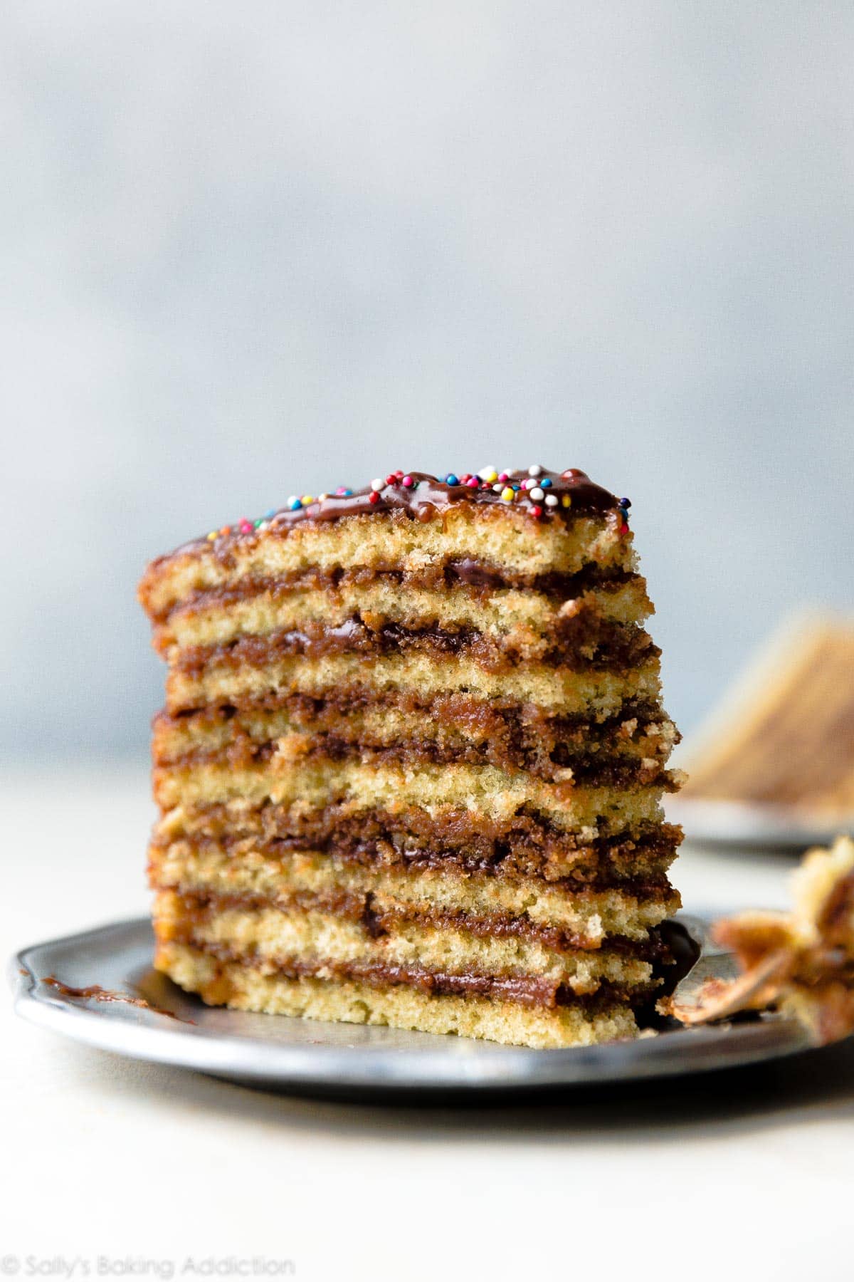 slice of Smith Island cake on a silver plate