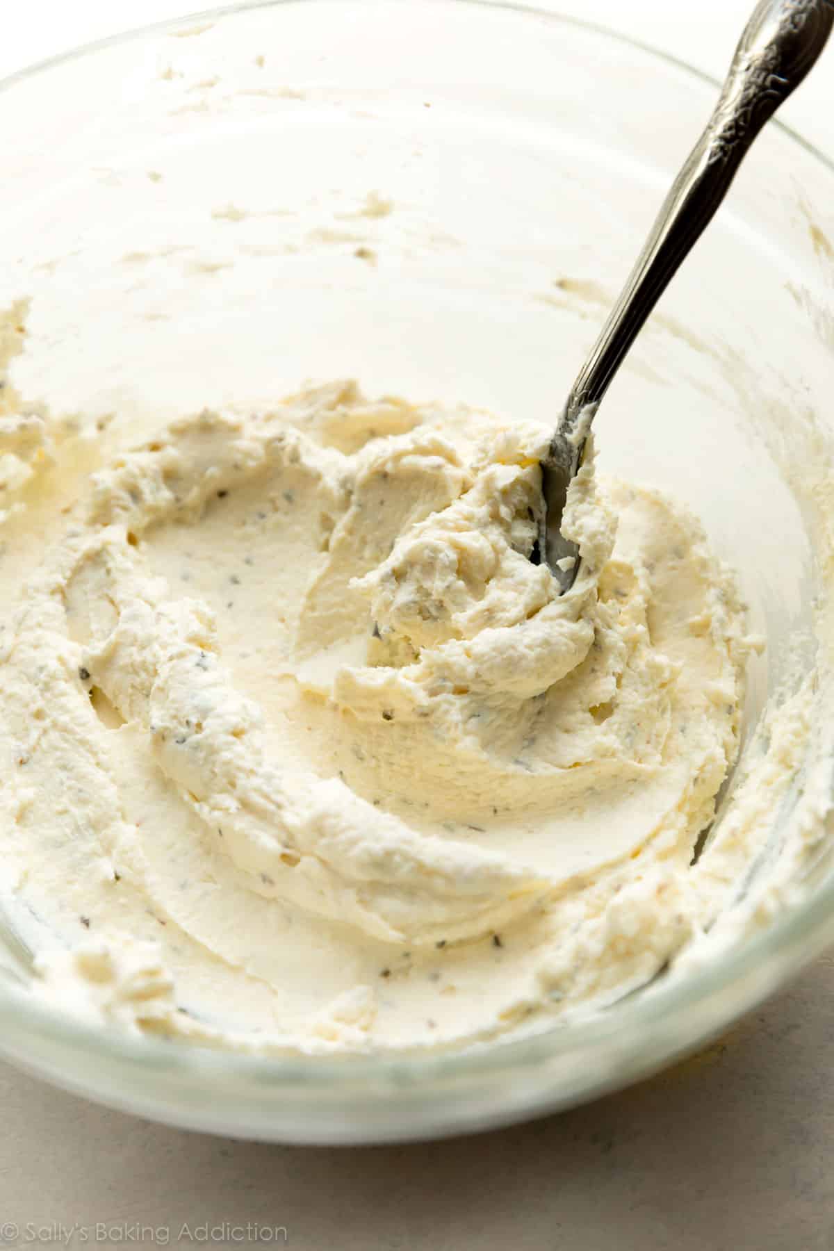 Garlic herb cream cheese in a glass bowl