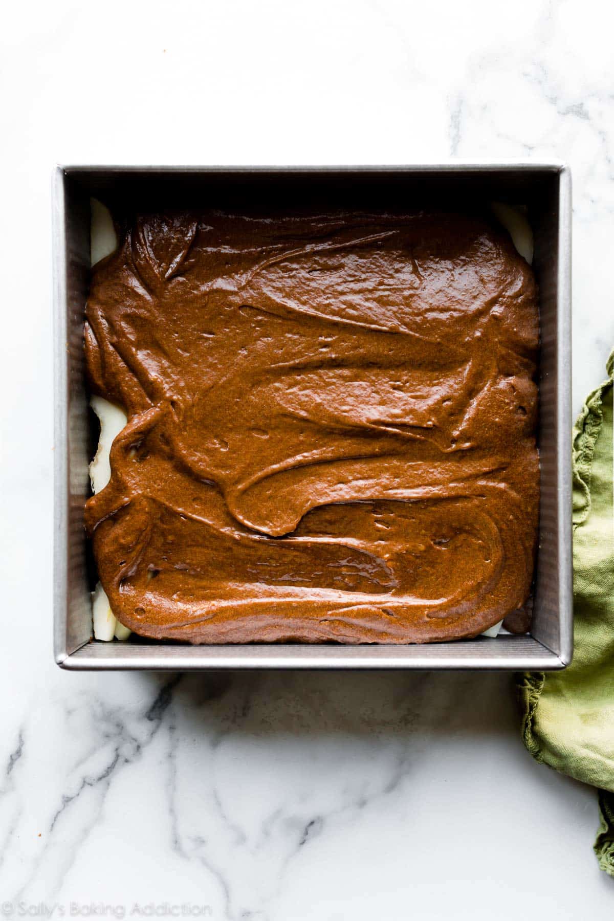 Gingerbread cake batter in a square pan