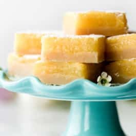 Lemon bars on teal cake stand