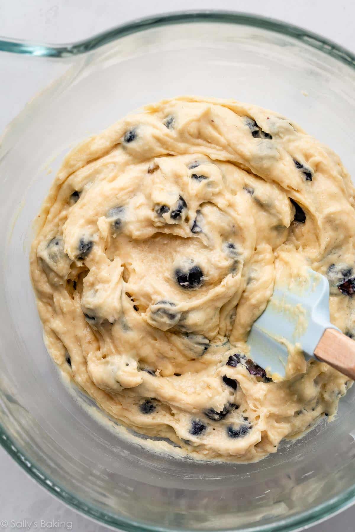 blueberry muffin batter in glass bowl.