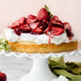 Strawberry shortcake cake on white cake stand