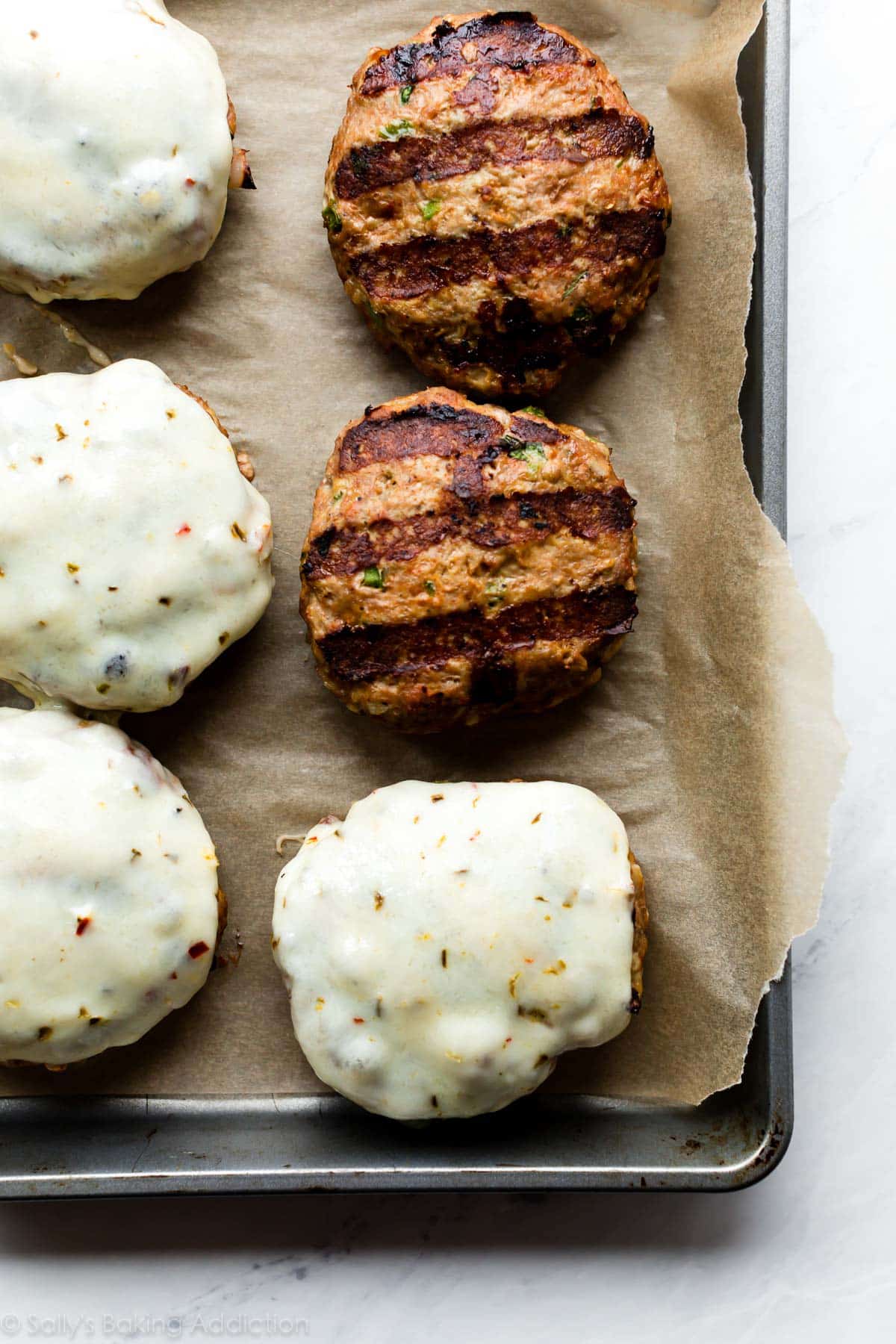 jalapeño turkey burgers on a baking sheet