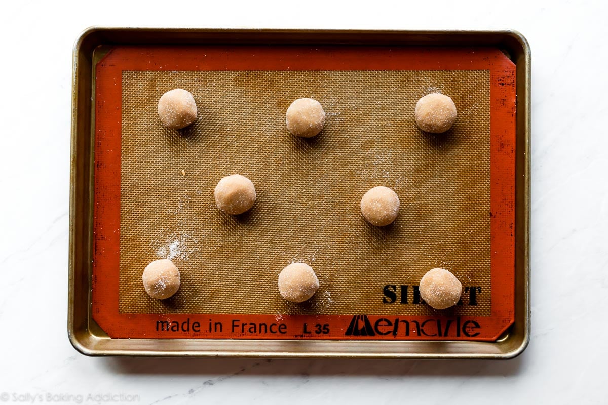 peanut butter cookie dough balls on baking sheet
