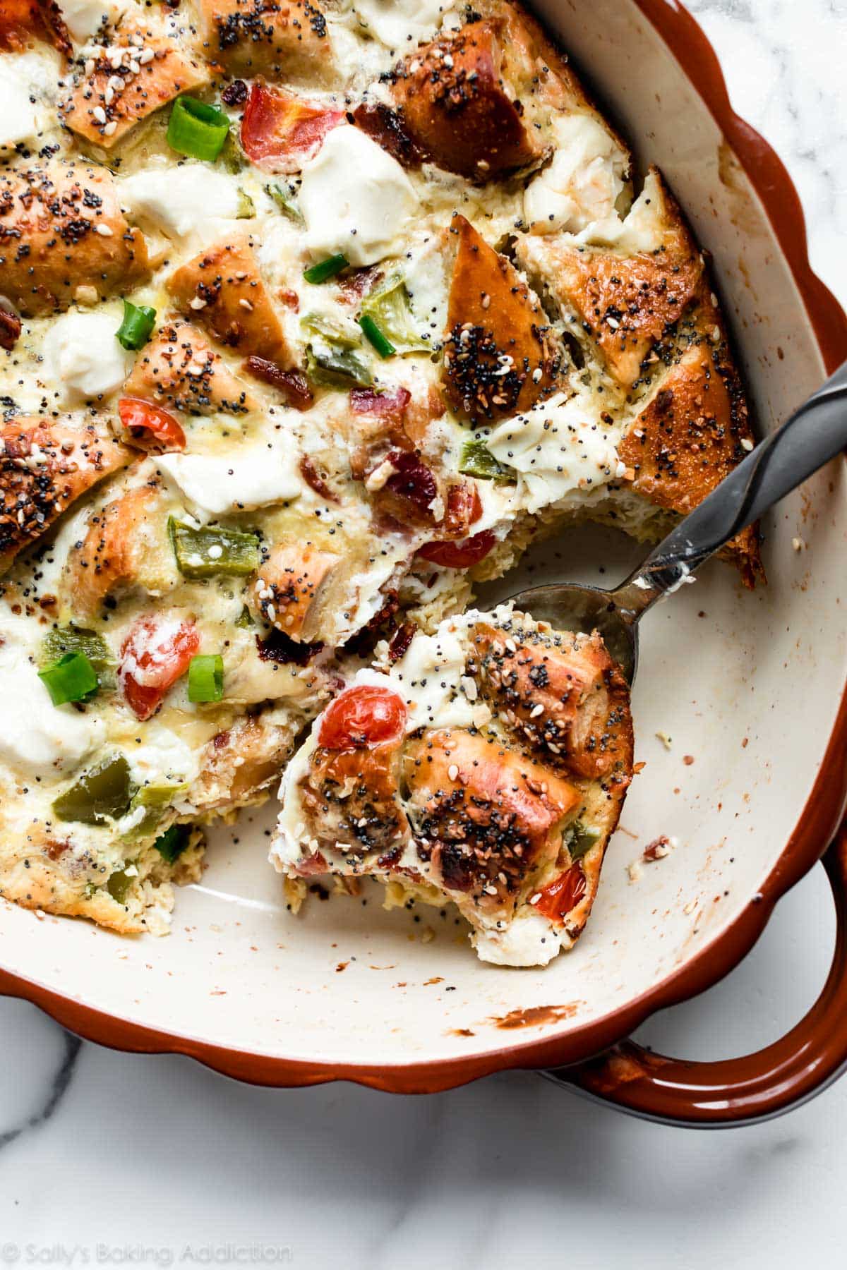 serving utensil with everything bagel breakfast casserole
