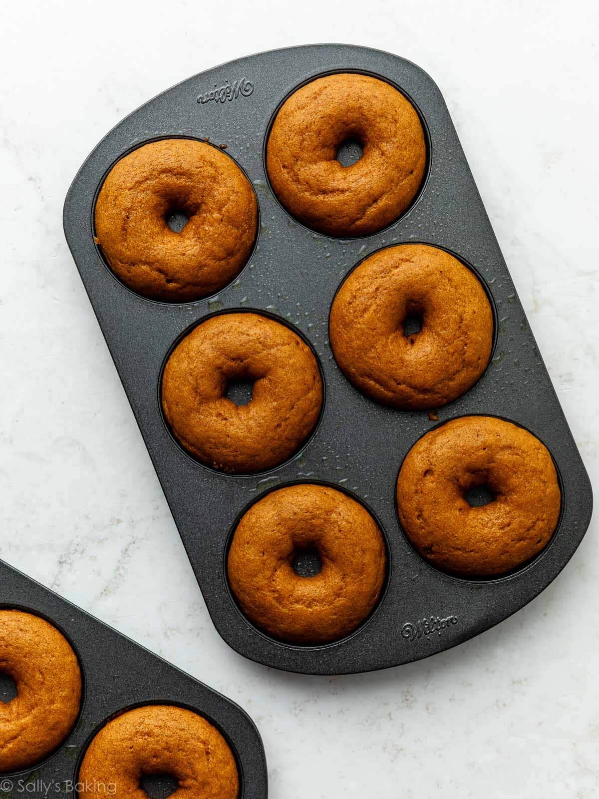 pumpkin donuts in donut pan.