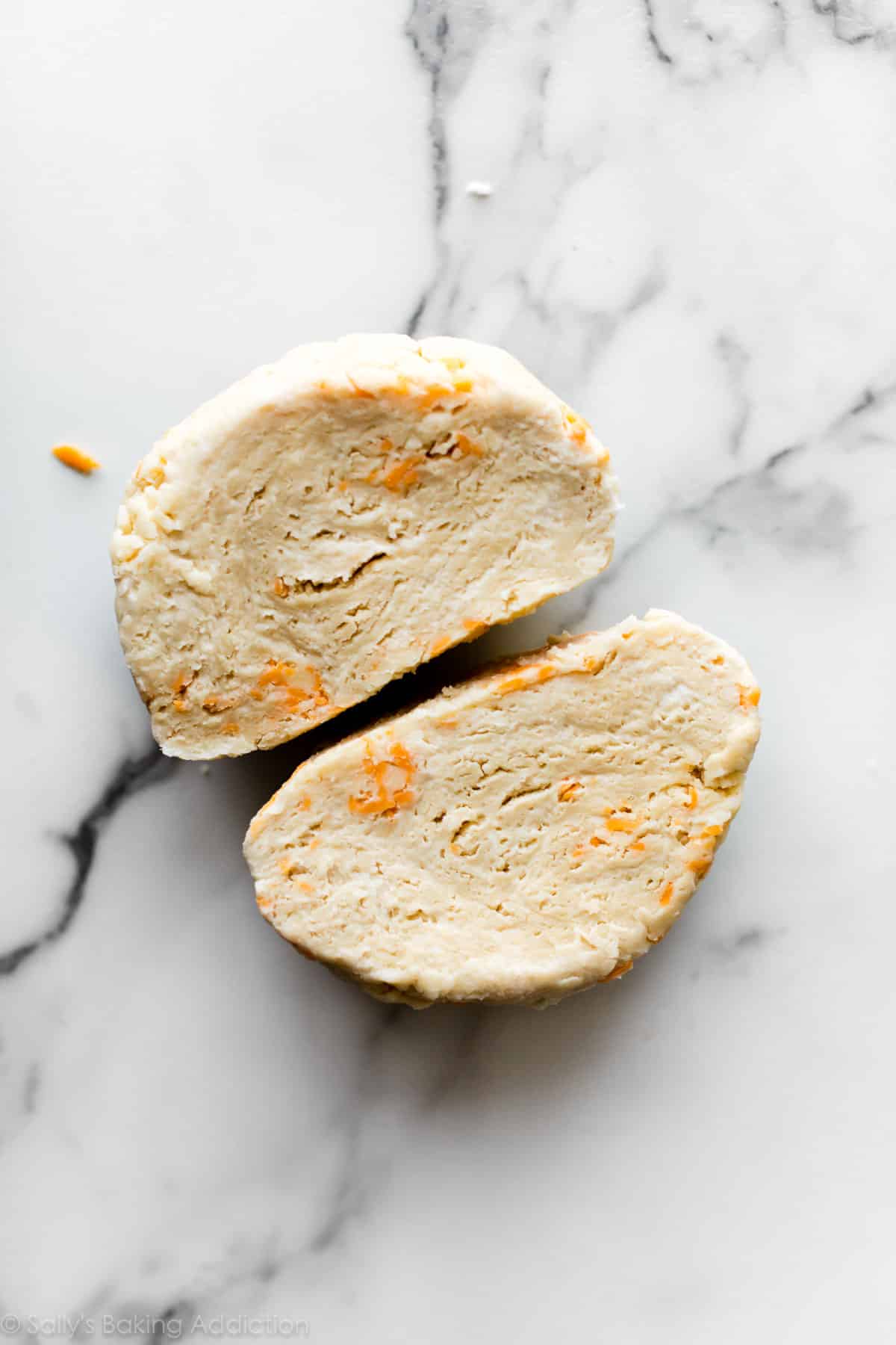 cheddar pie dough cut in half