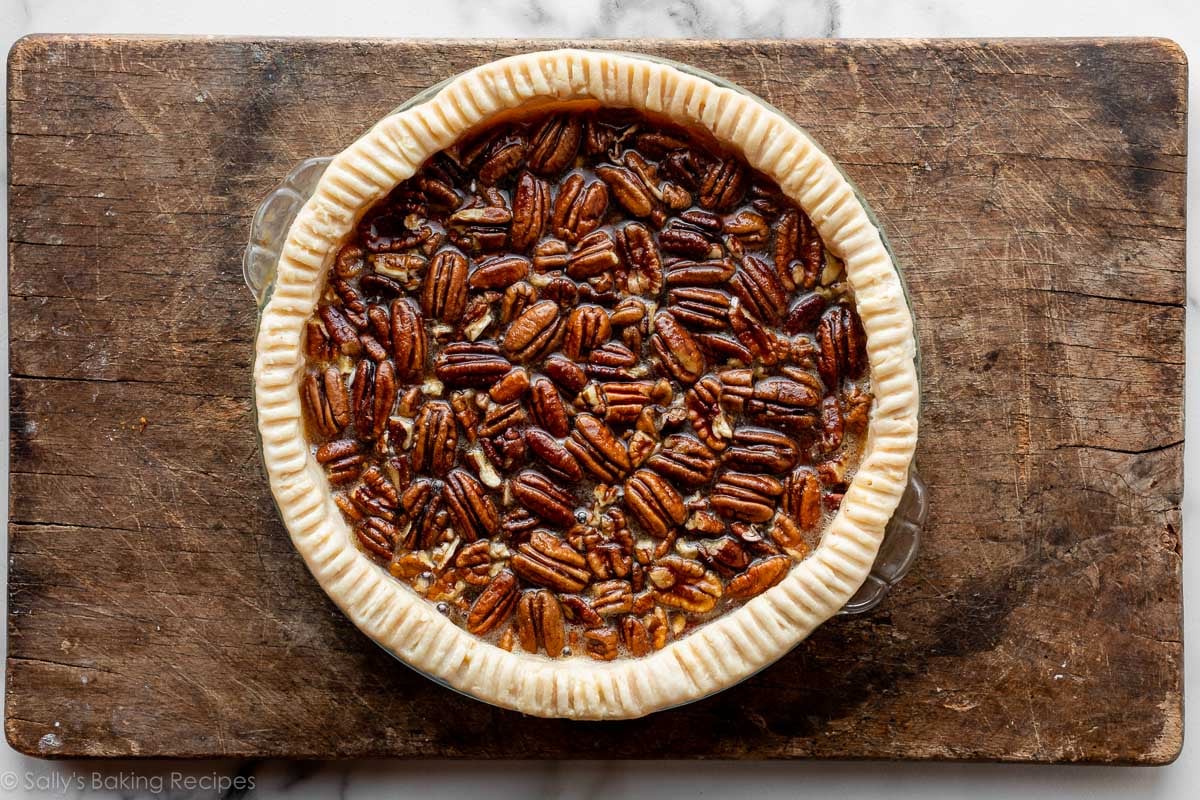 pecans in pie dough before baking.