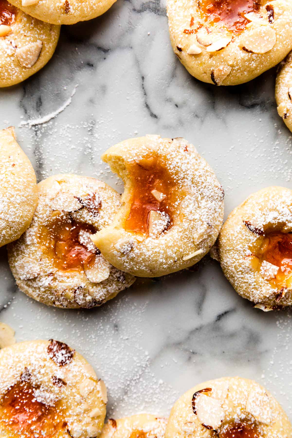 cream cheese thumbprint cookies with apricot jam in the center