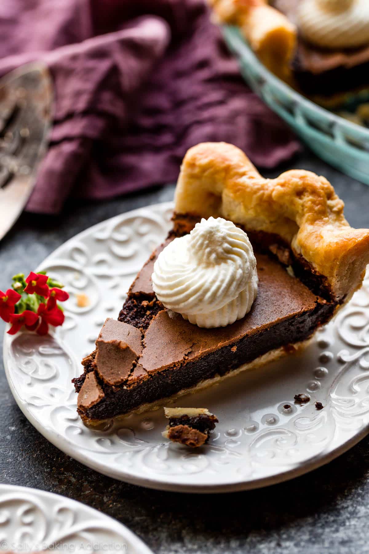 slice of chocolate chess pie with whipped cream on top