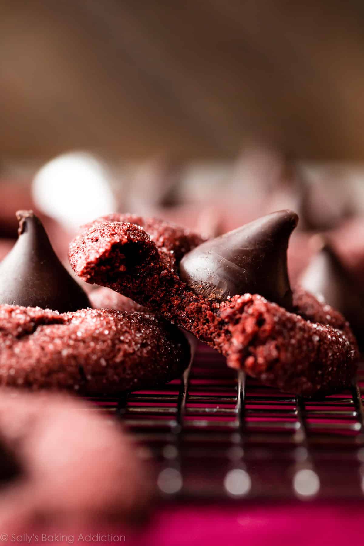 red velvet cookie with a Hershey's Kiss on top and a bite taken out