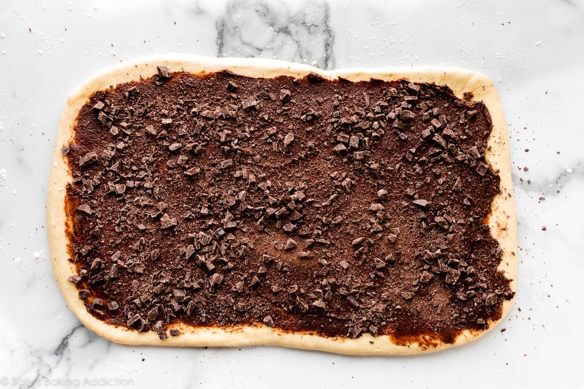 rolled out dough with chocolate filling on top