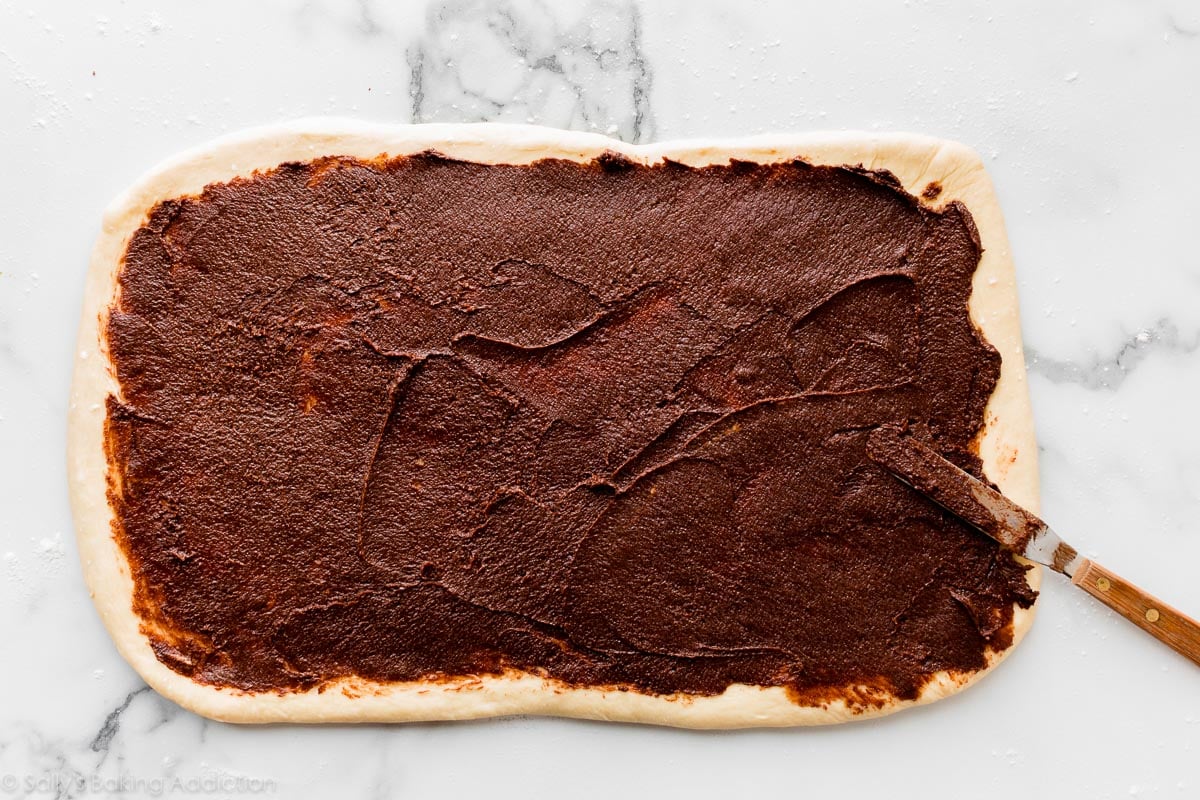 rolled out dough with chocolate filling on top