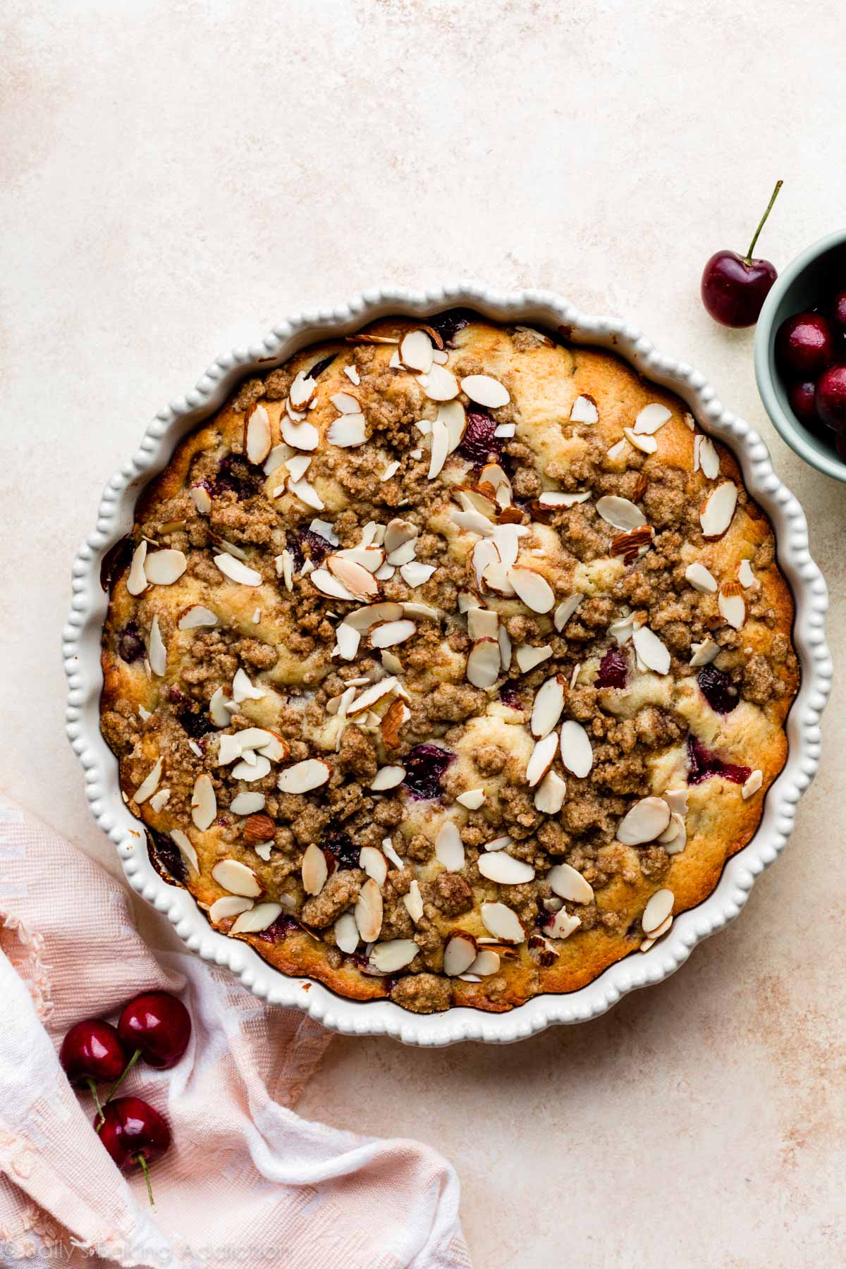 cherry almond buckle in white pie dish