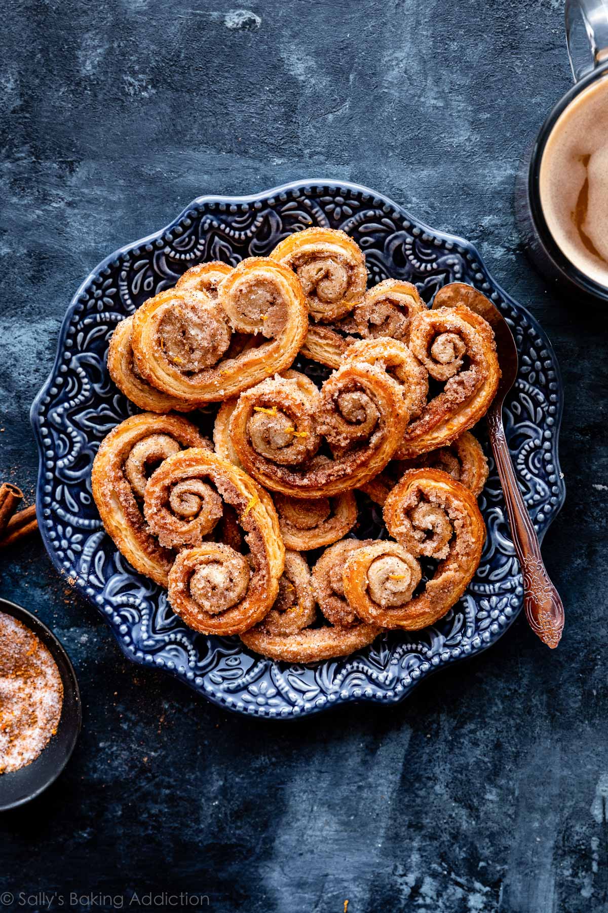 cinnamon spice palmier cookies on blue plate