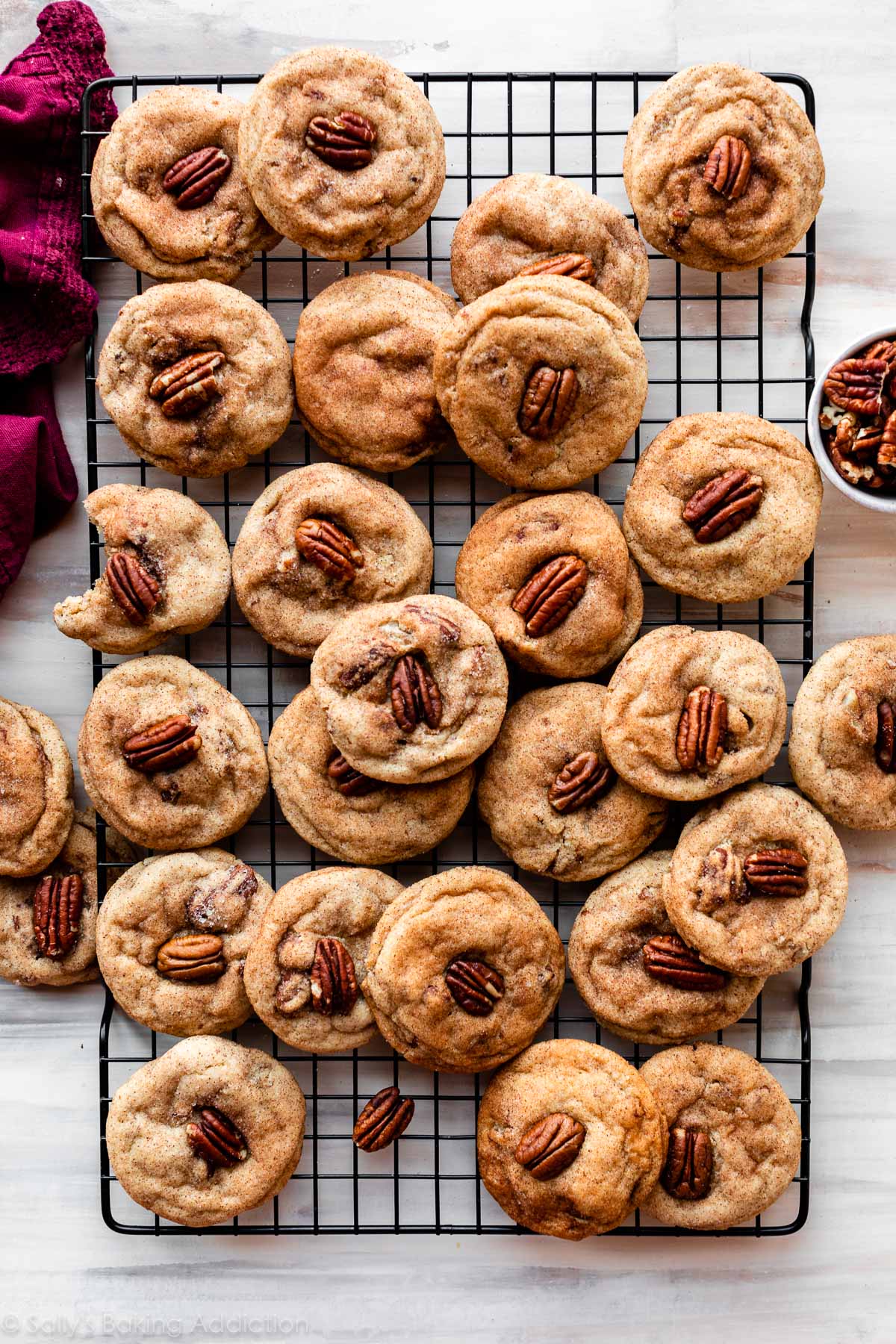 maple pecan snickerdoodles on black cooling rack