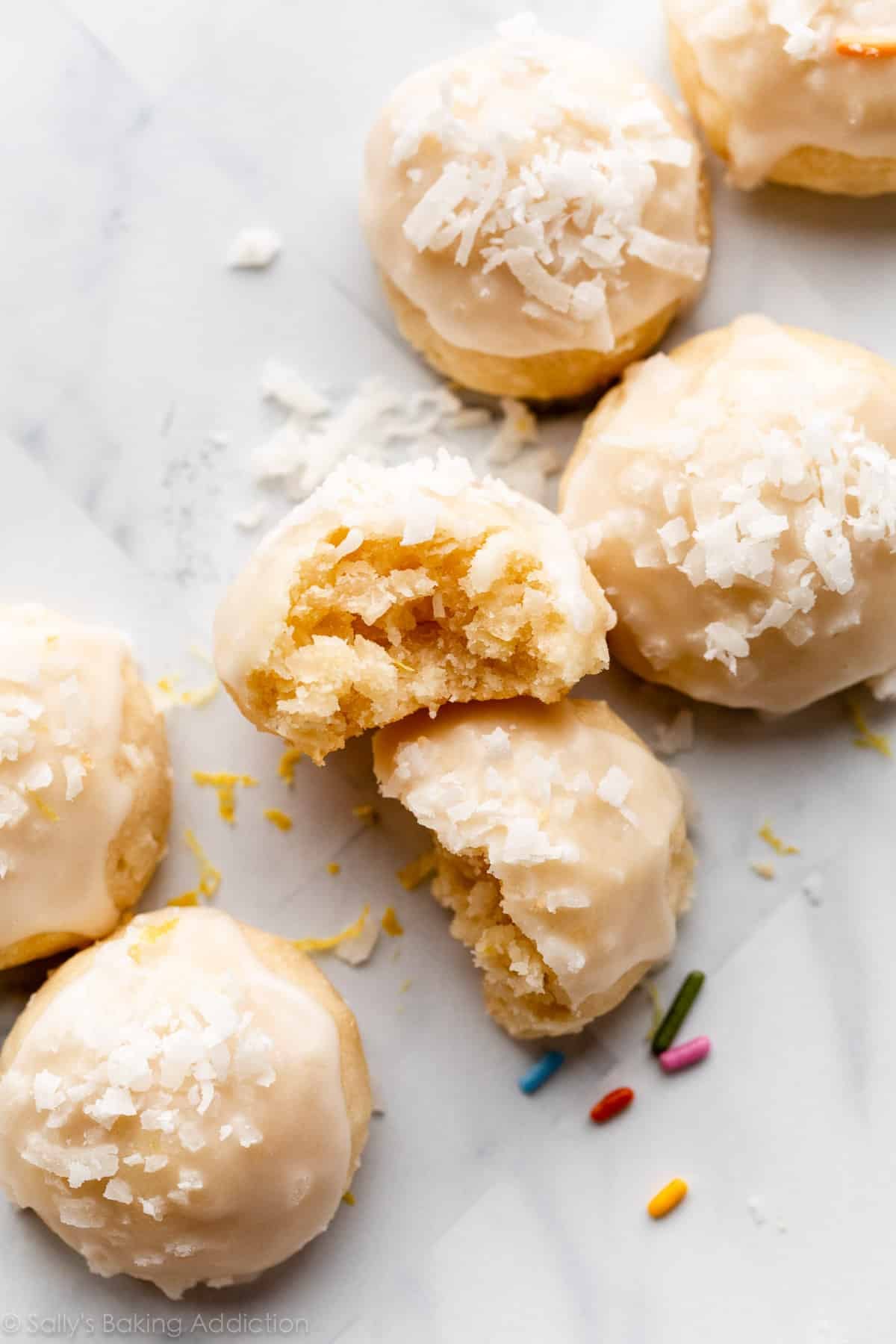 glazed lemon coconut drop shortbread-style cookies with coconut on top