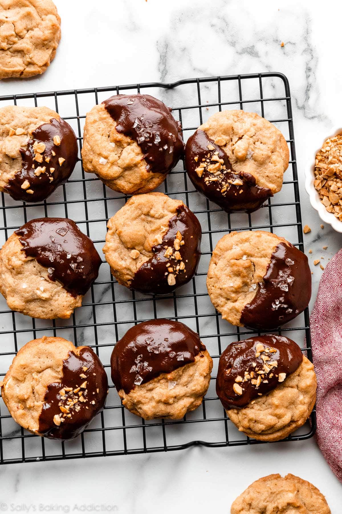 peanut butter cookies dipped halfway into chocolate