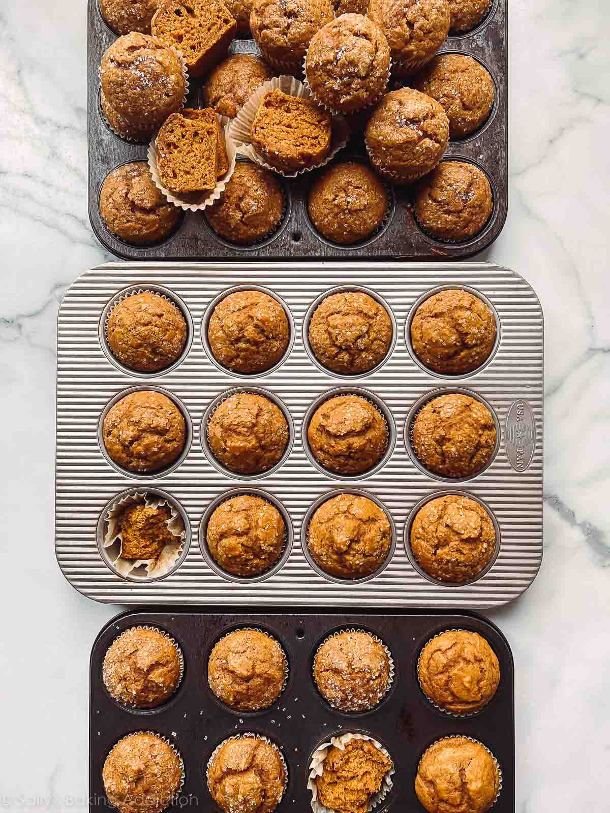 3 baking pans of pumpkin muffins.