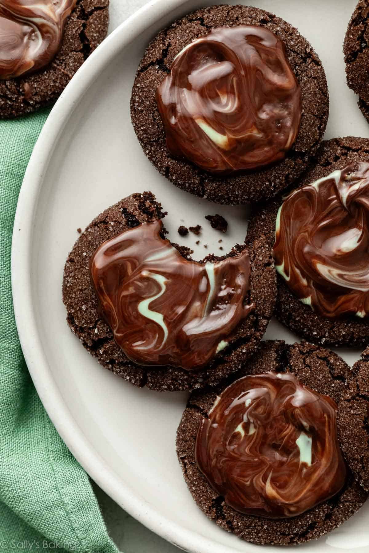 close-up photo of melted Andes mint frosted chocolate cookies on plate.