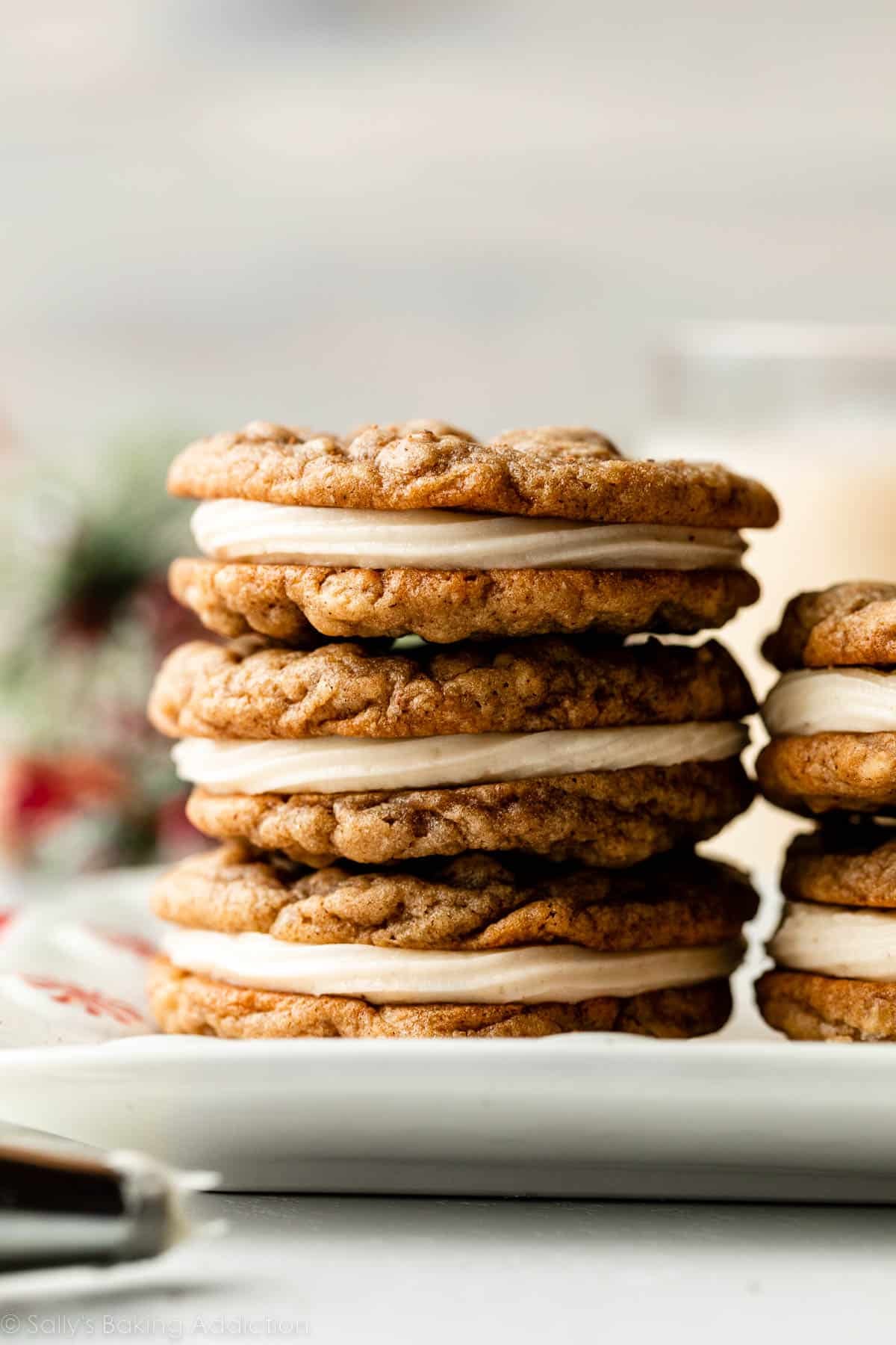 stack of 3 eggnog oatmeal cream pie cookies.