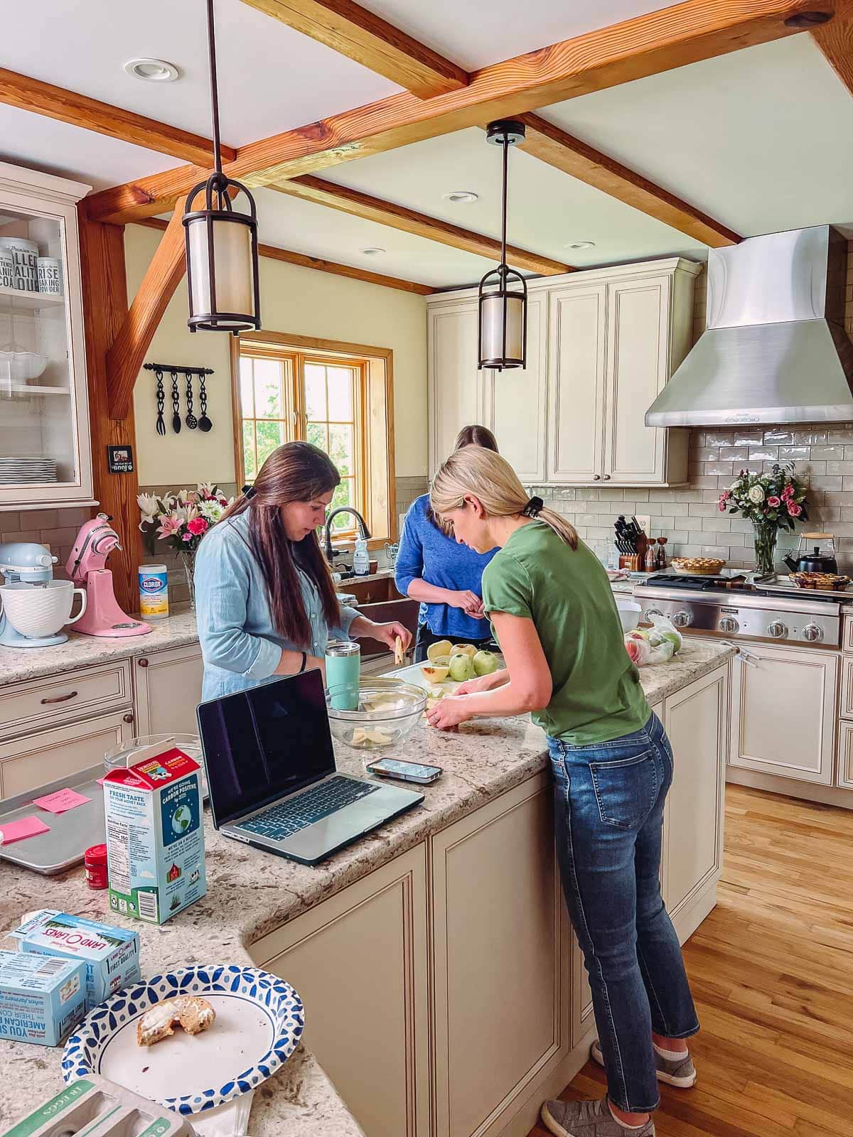Sally and team at counter preparing food.
