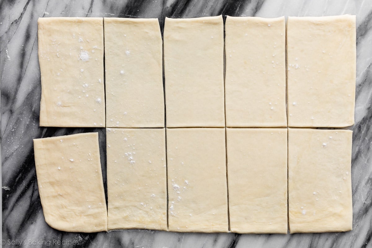 rolled out and cut pastry dough on marble board.