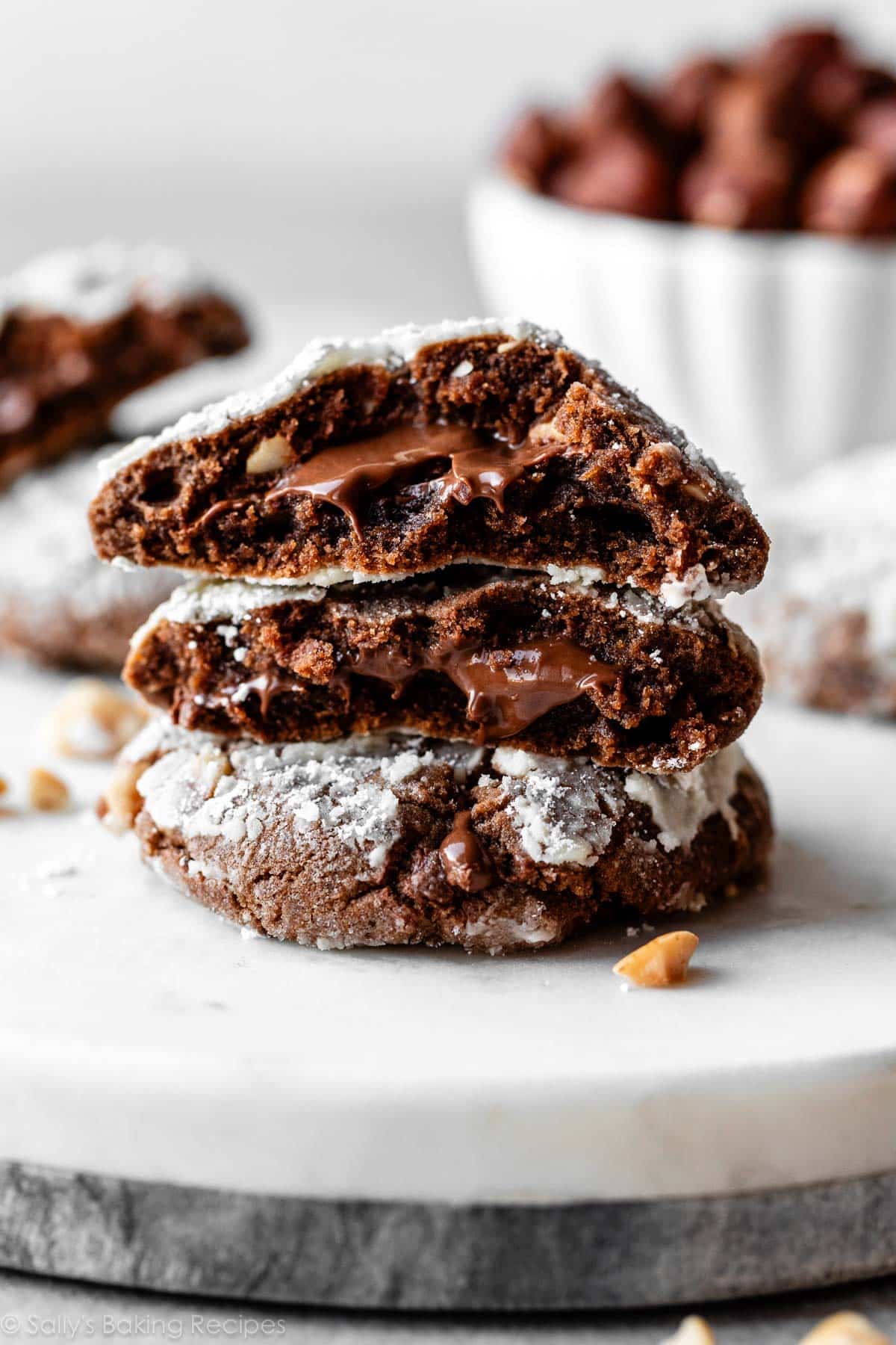 stack of Nutella crinkle cookies with gooey Nutella in the center.