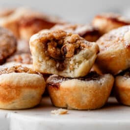 one maple walnut tassie with bite taken out on top of another.