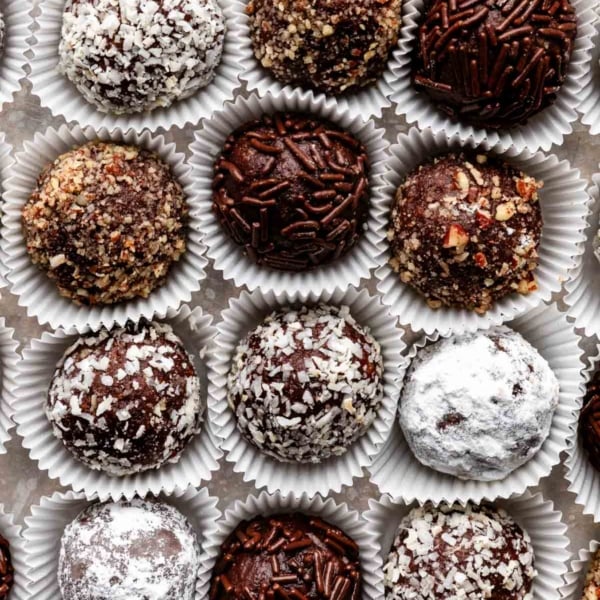 overhead close-up shot of rum balls coated in various toppings.