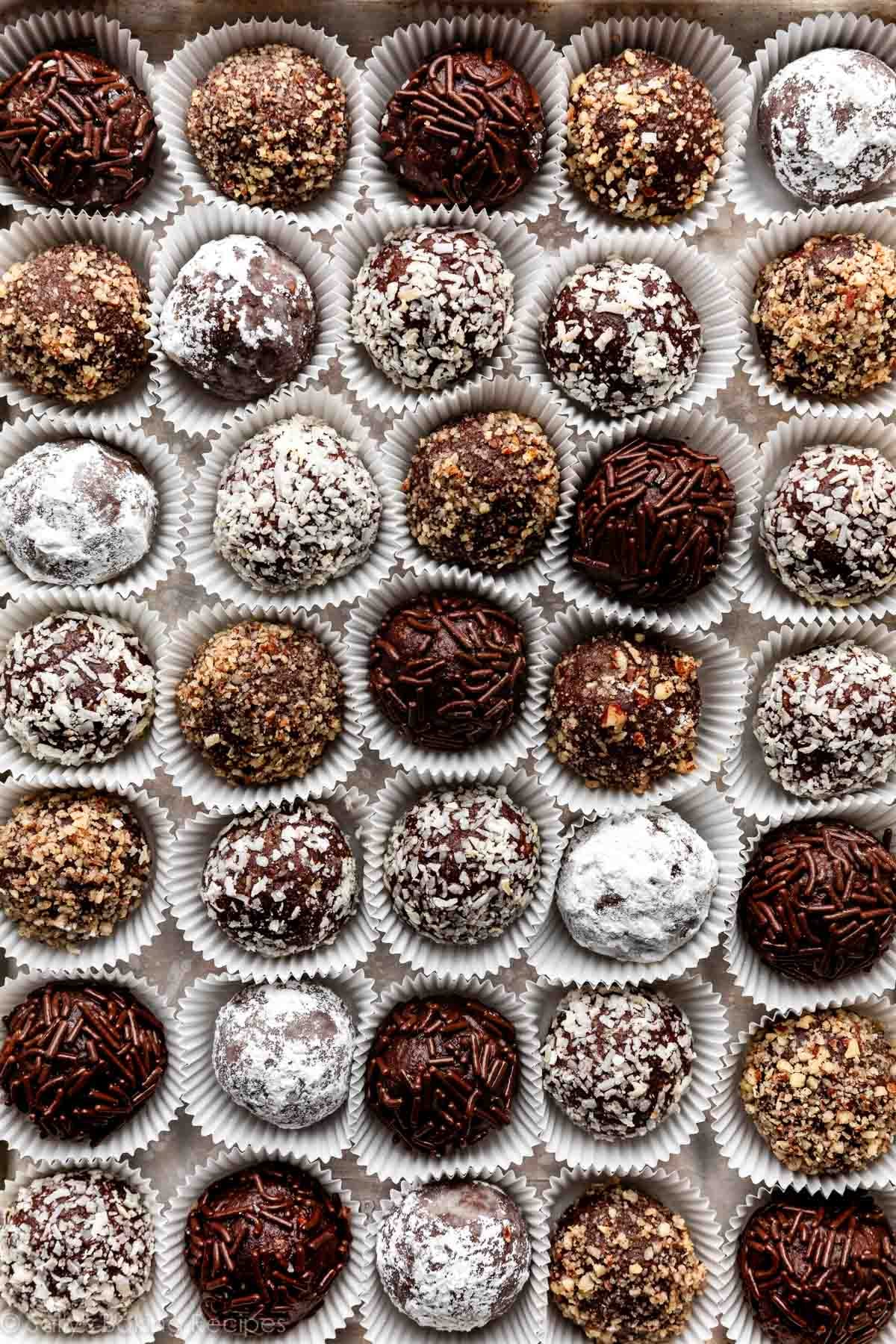 overhead close-up shot of rum balls coated in various toppings.