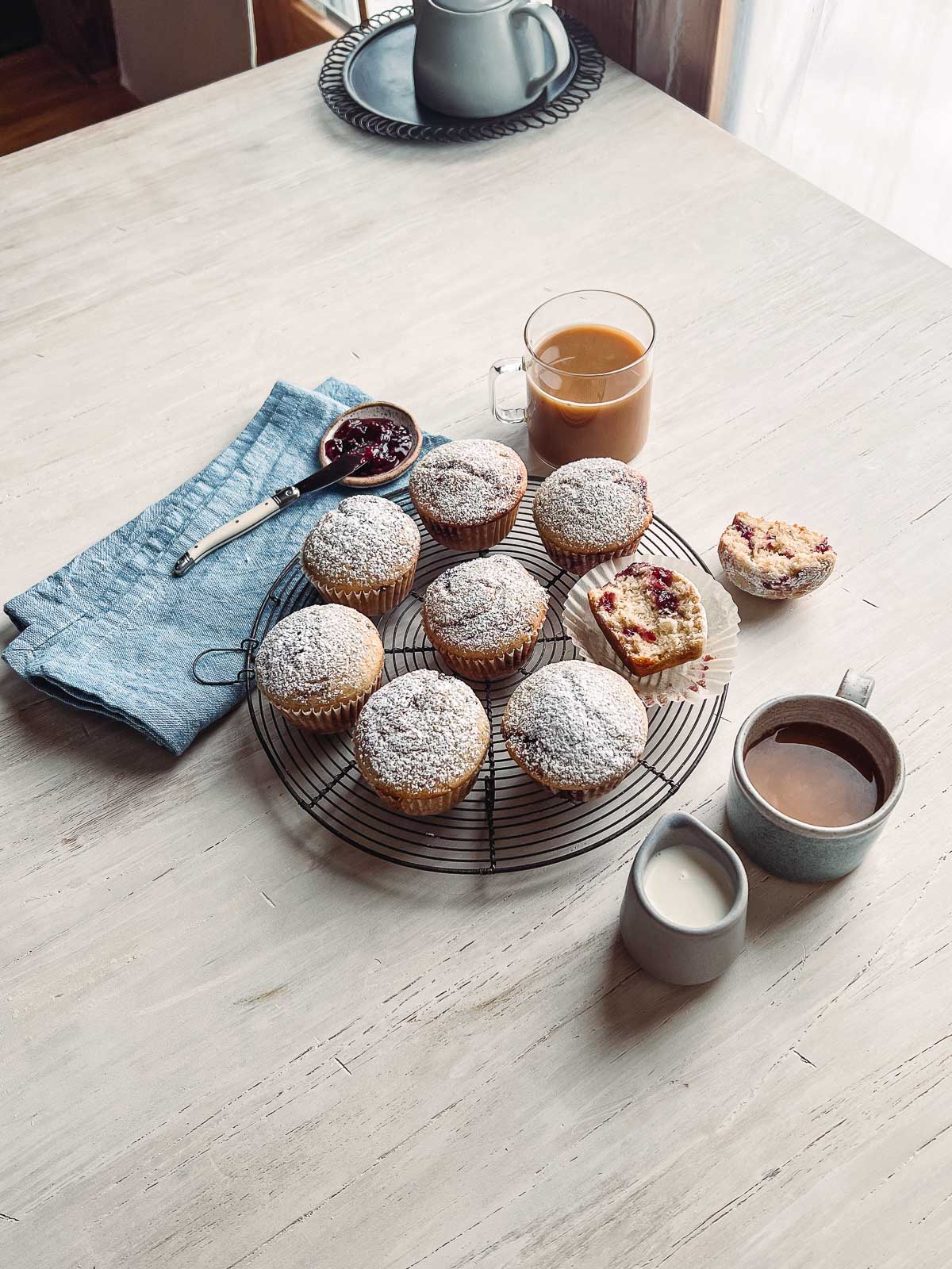 muffins on wire cooling rack on photography board.