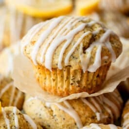 close-up of lemon poppy seed muffin with icing on top.
