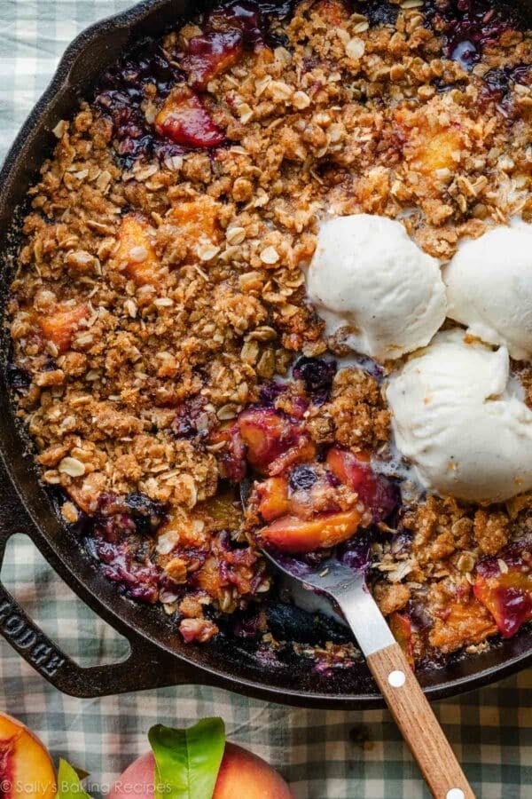 brown butter blueberry peach crisp in cast iron skillet.