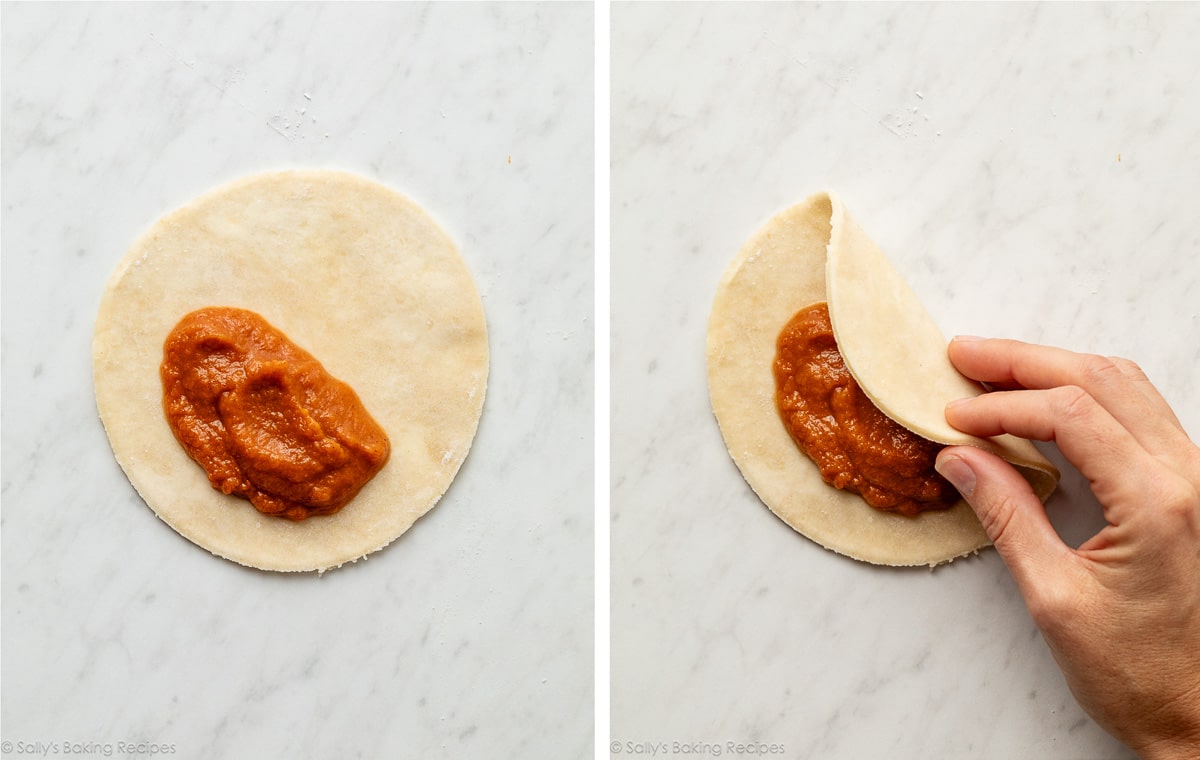 pumpkin filling in pie dough circle and hand folding it over.