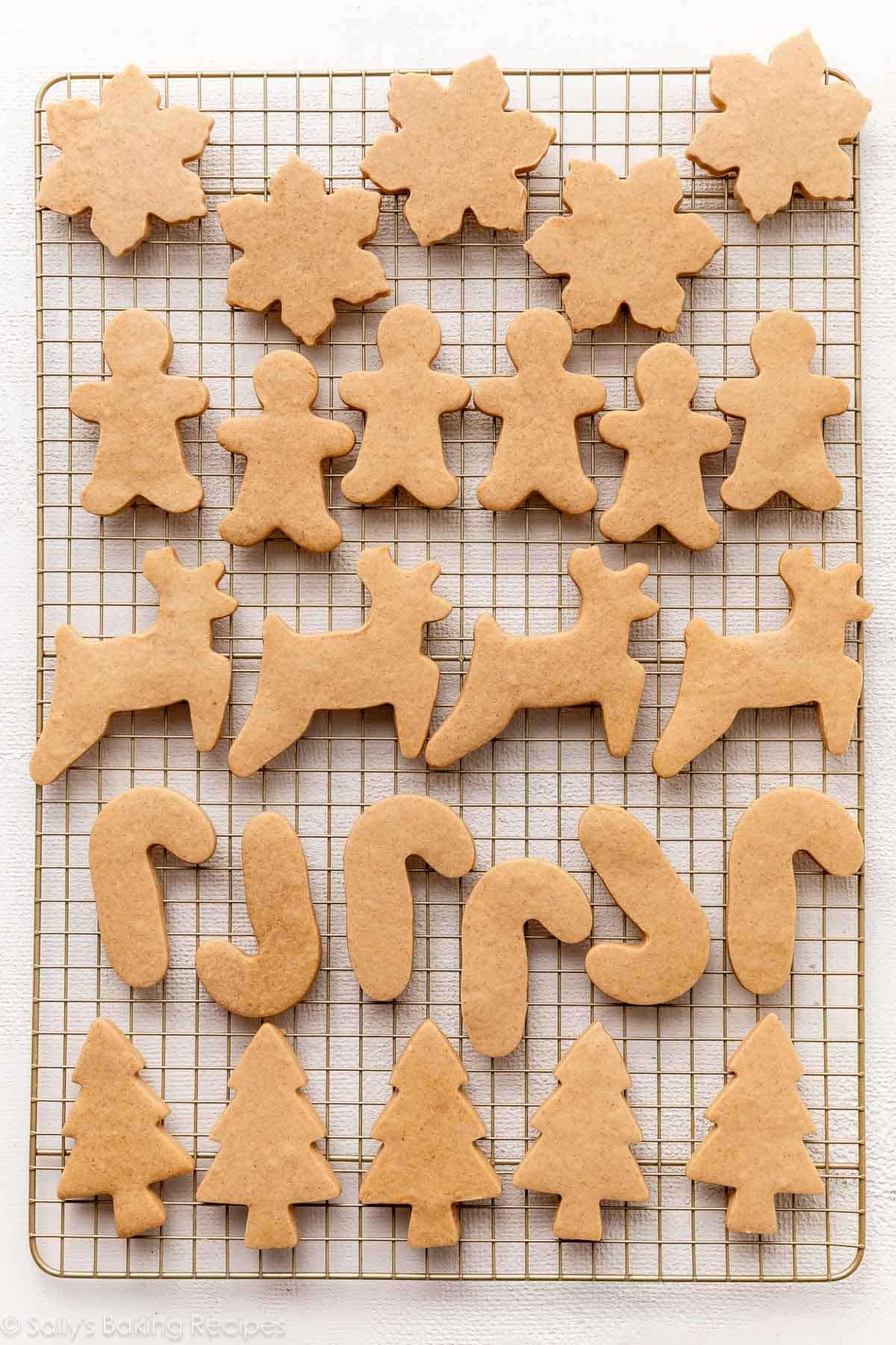 baked brown sugar cookie cutter cookies on gold cooling rack.