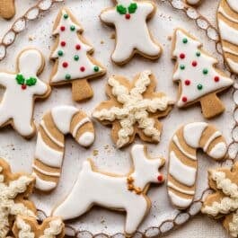decorated brown sugar cut out cookies in Christmas shapes.