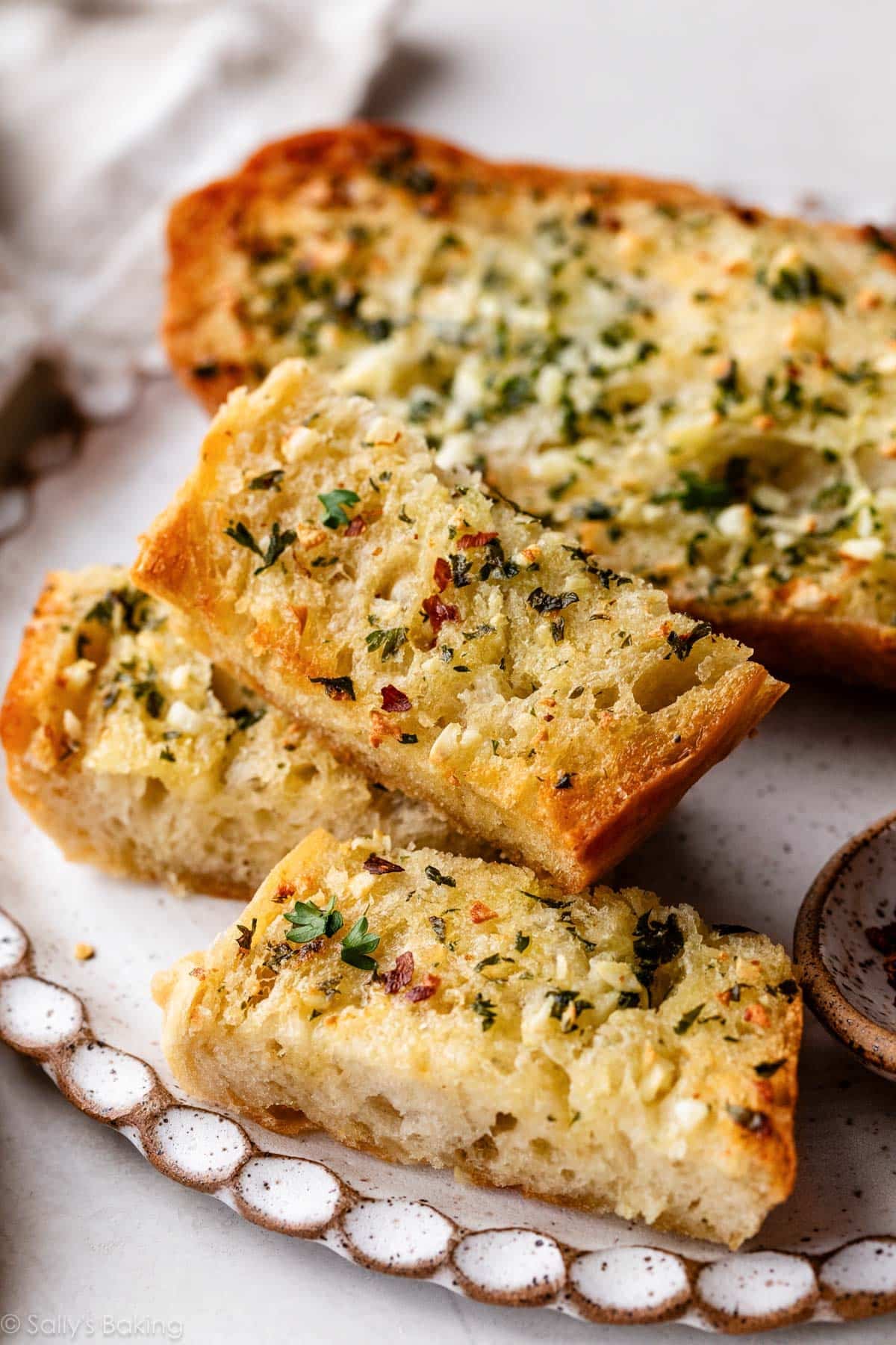 slices of homemade garlic bread on plate.