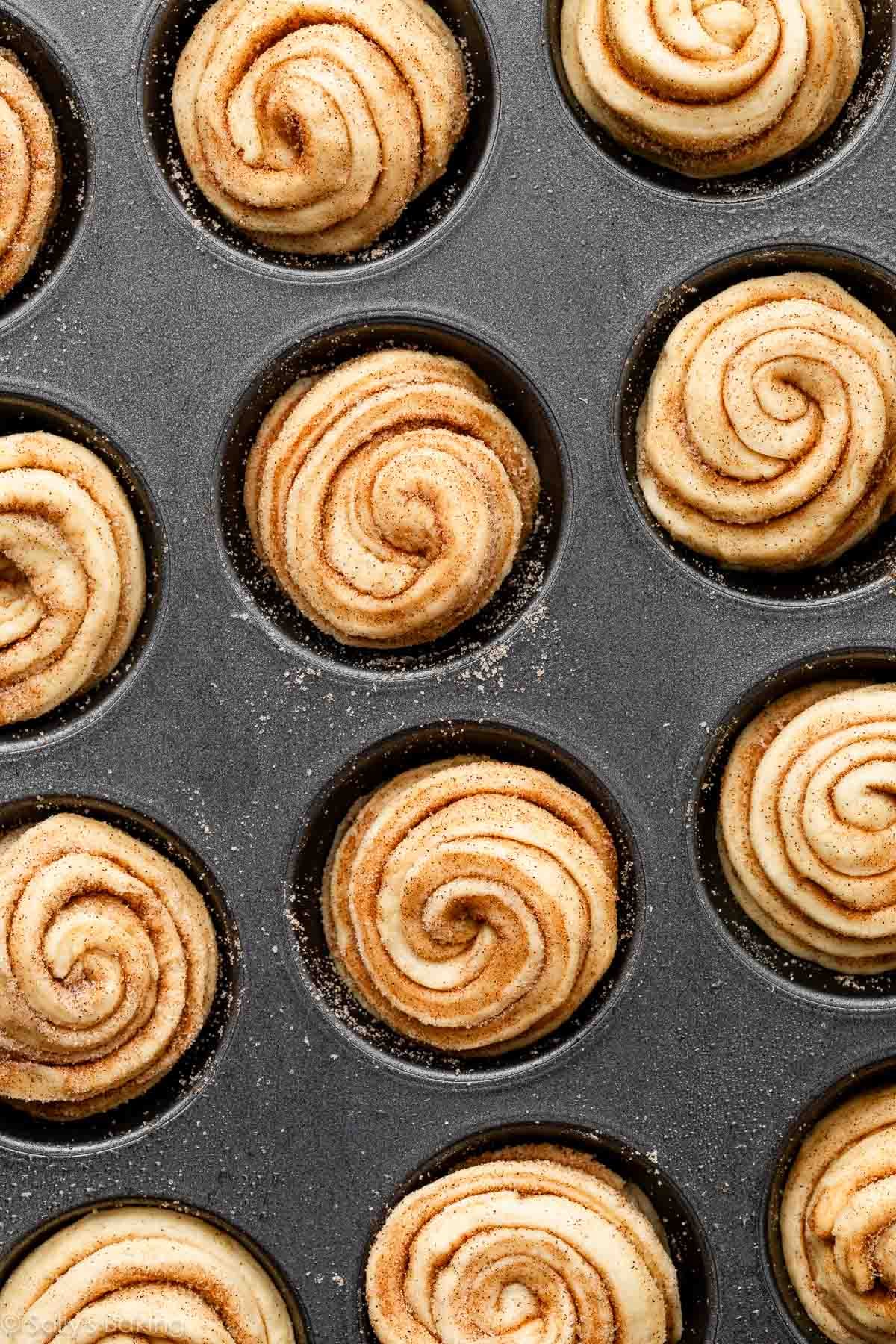 overhead image of cruffins in mufifn pan before baking.