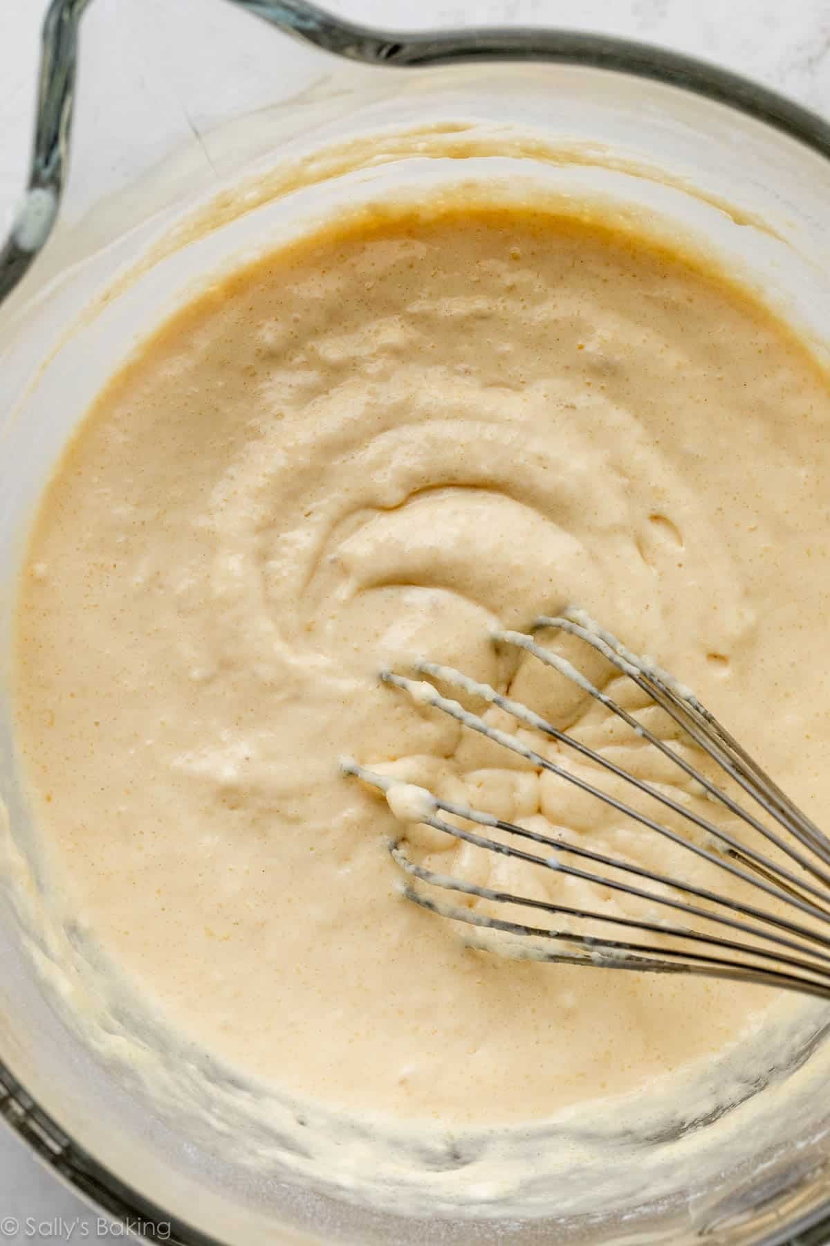 thick batter in glass bowl with whisk.