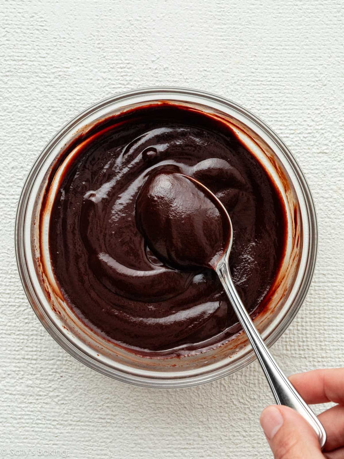 bowl of chocolate ganache with spoon.