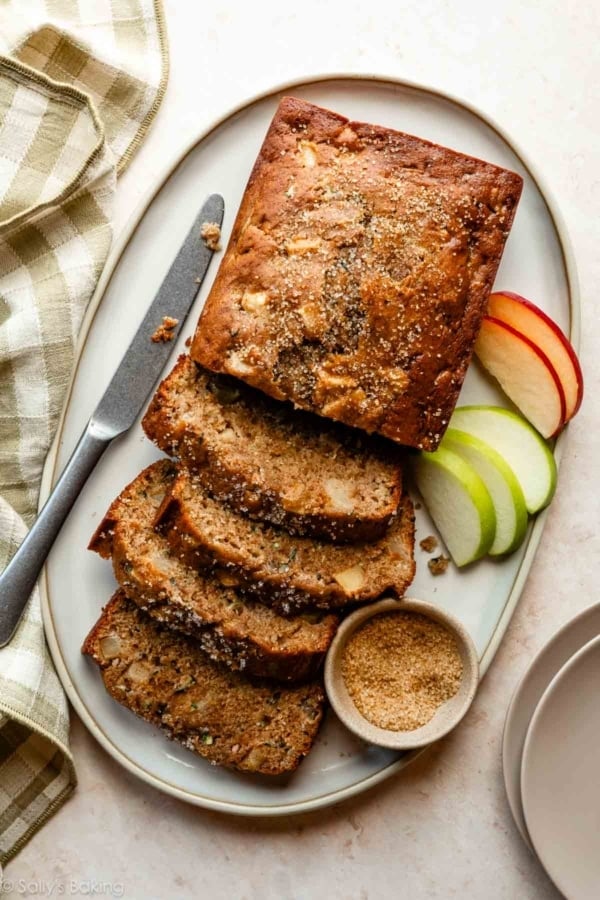 apple zucchini bread cut into slices on platter.