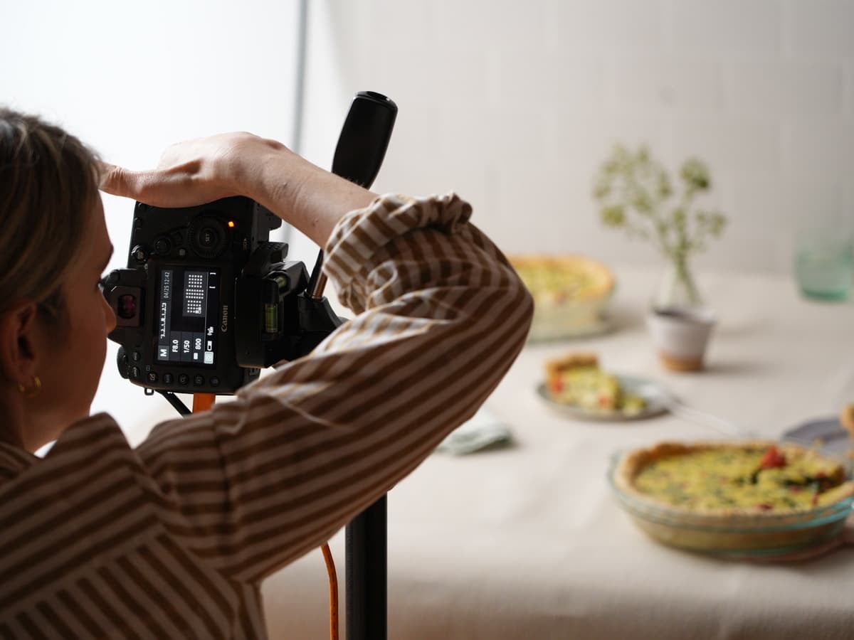 Sally taking photo of quiche.