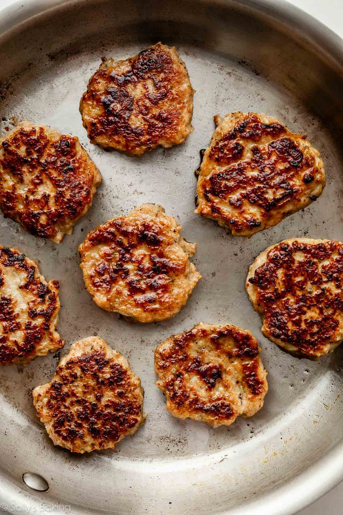 homemade chicken sausage patties in a skillet.